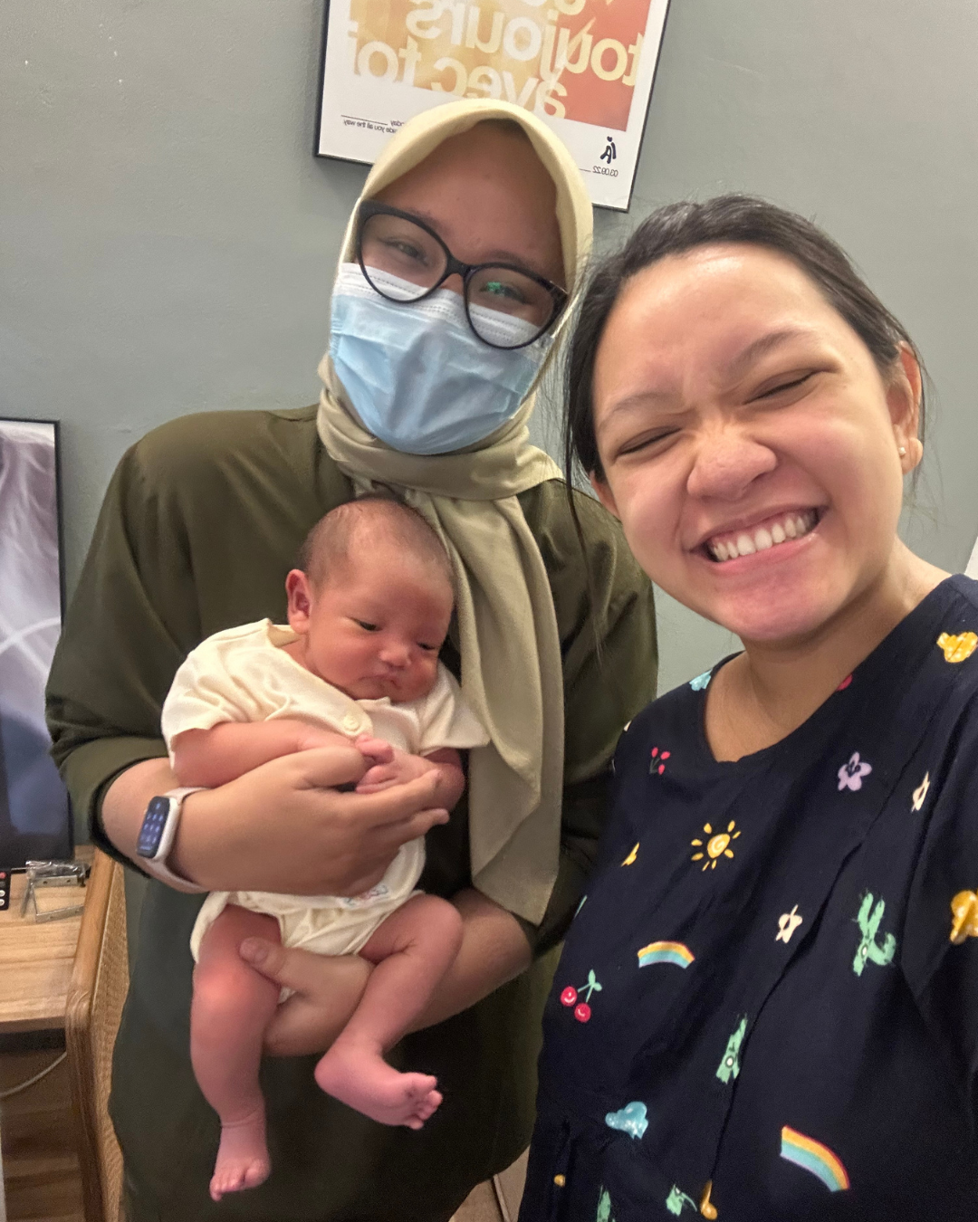 Gardenia midwife and mother with a healthy baby